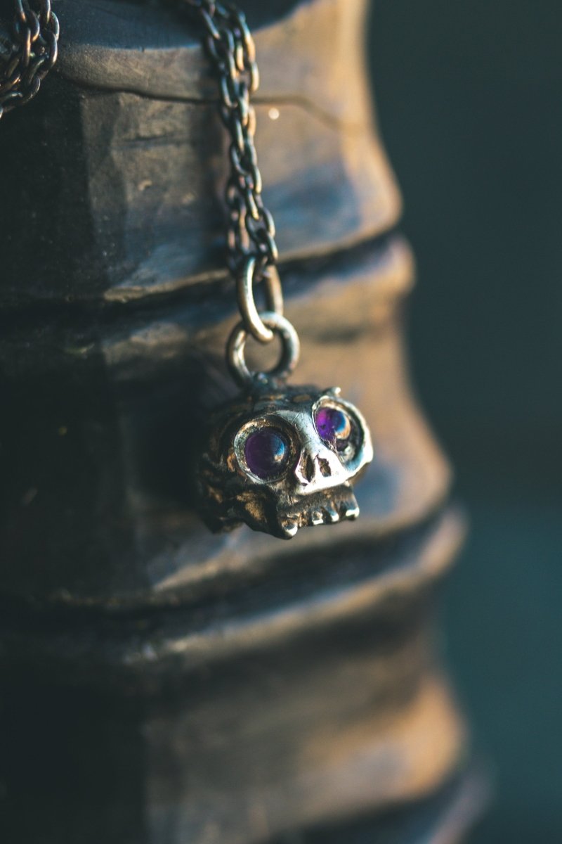 Memento Mori Skull Charm with Amethyst Eyes: A Reflection of Life’s Duality - Machinations