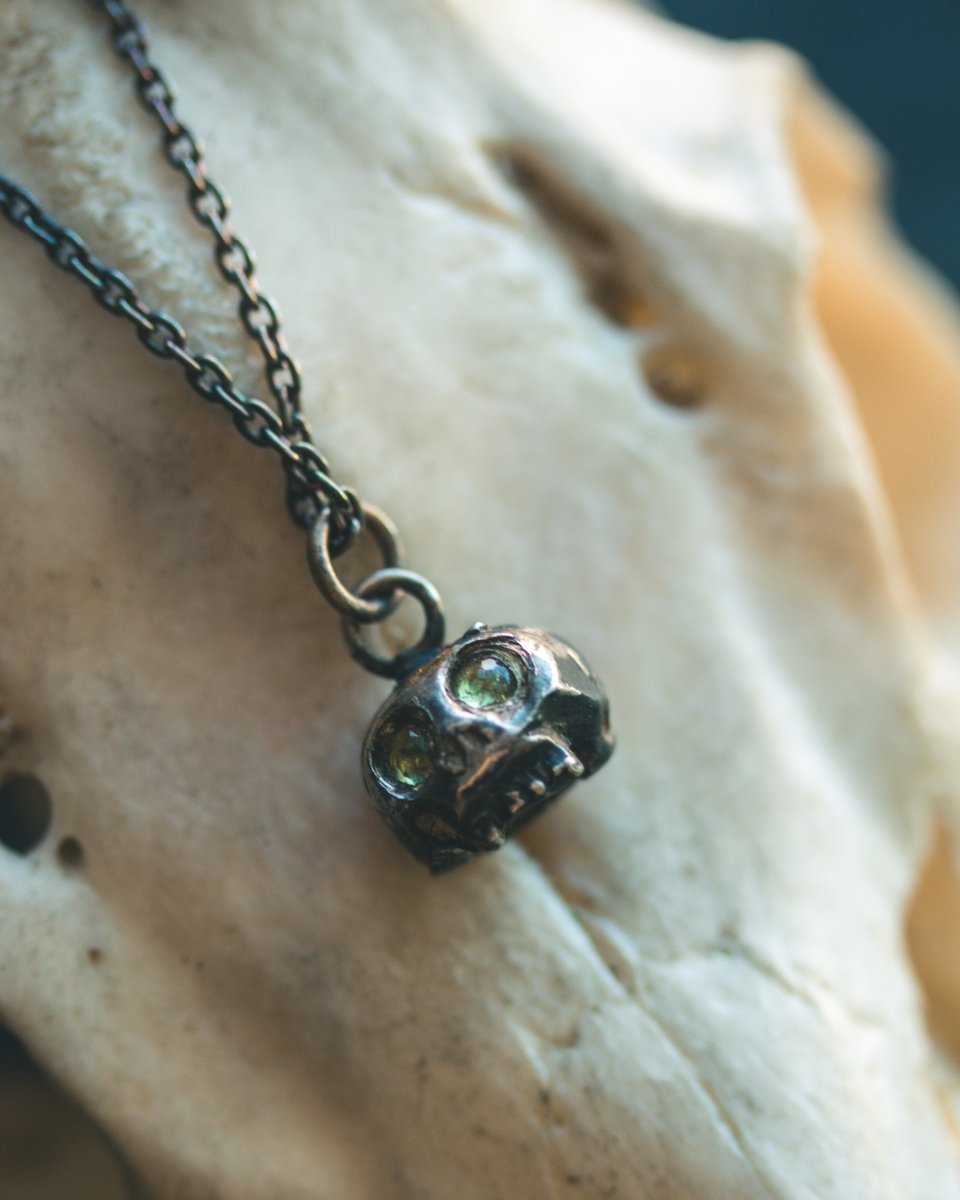 Memento Mori Skull Charm with Peridot Eyes: A Reflection of Life’s Duality - Machinations