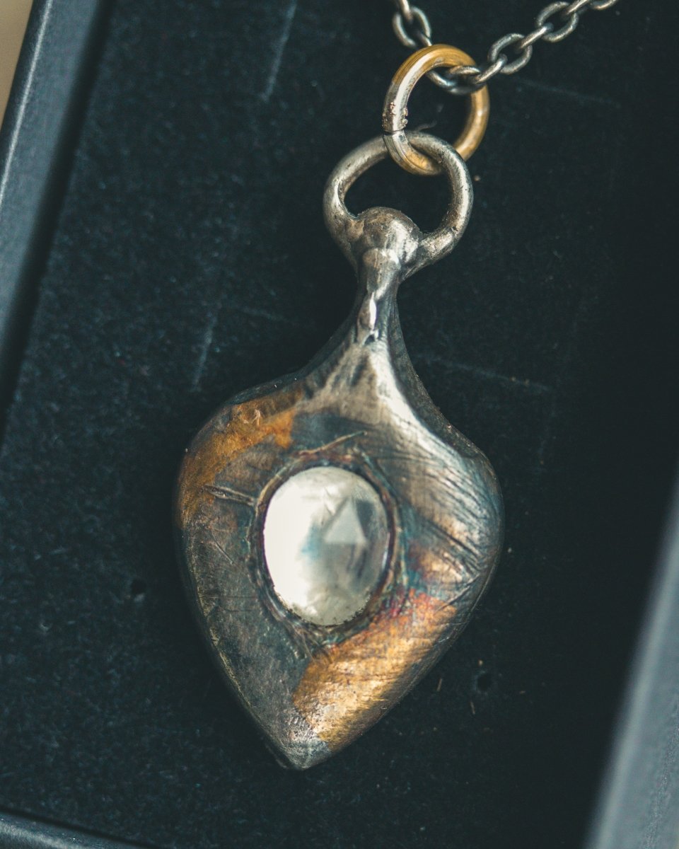 Ancient Echoes Amulet with Moonstone: Handcrafted Silver Amulets with 23.5K Gold Accents - Machinations