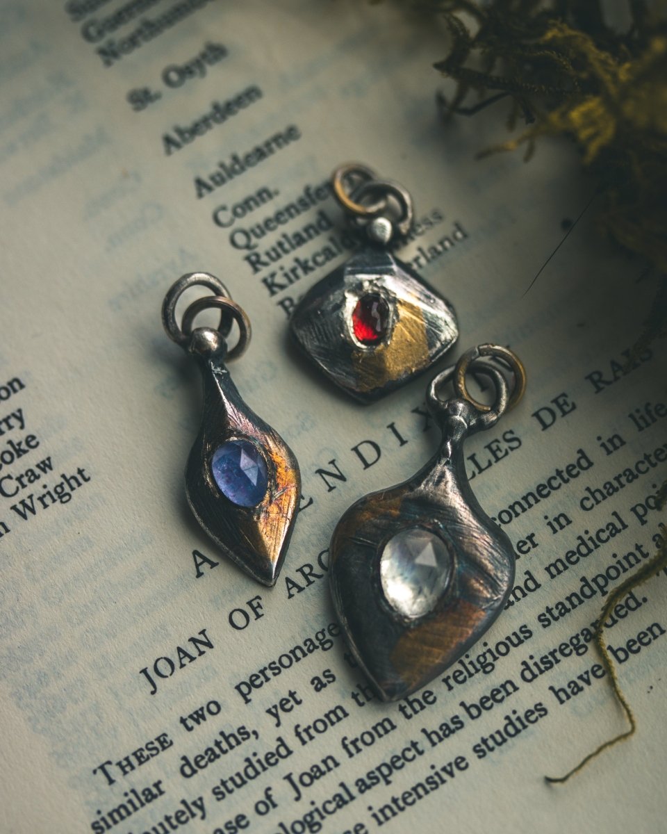 Ancient Echoes Amulet with Moonstone: Handcrafted Silver Amulets with 23.5K Gold Accents - Machinations