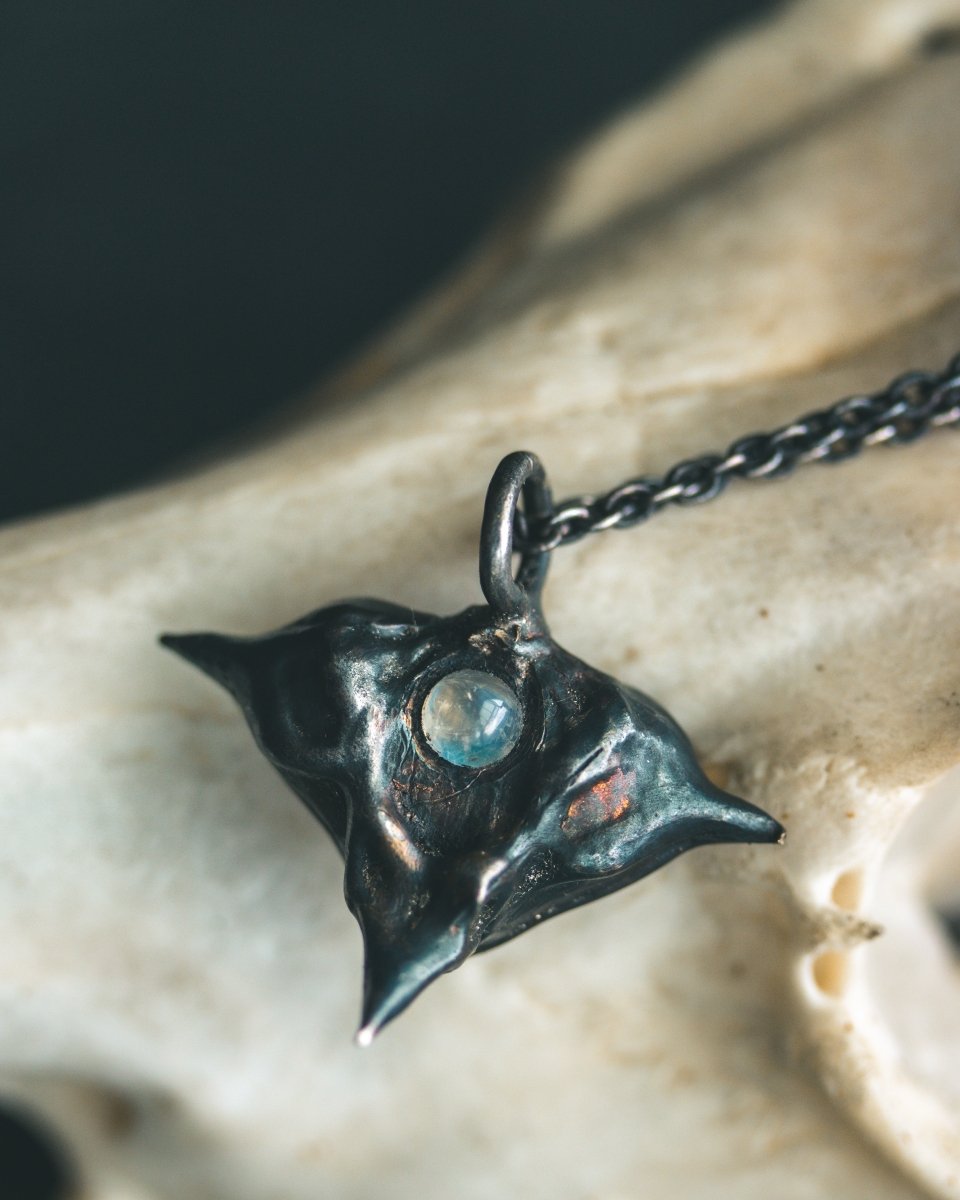 Devil Pods Charm with Moonstone: Handcrafted Silver Charm with 23.5K Gold Accents - Machinations