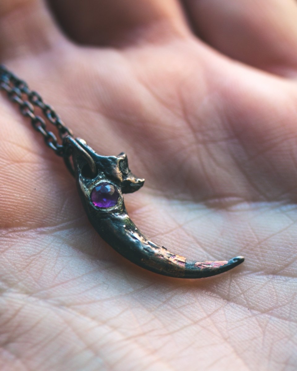 Great Horned Owl Talon Pendant with Amethyst: A Symbol of Wisdom and Power - Machinations