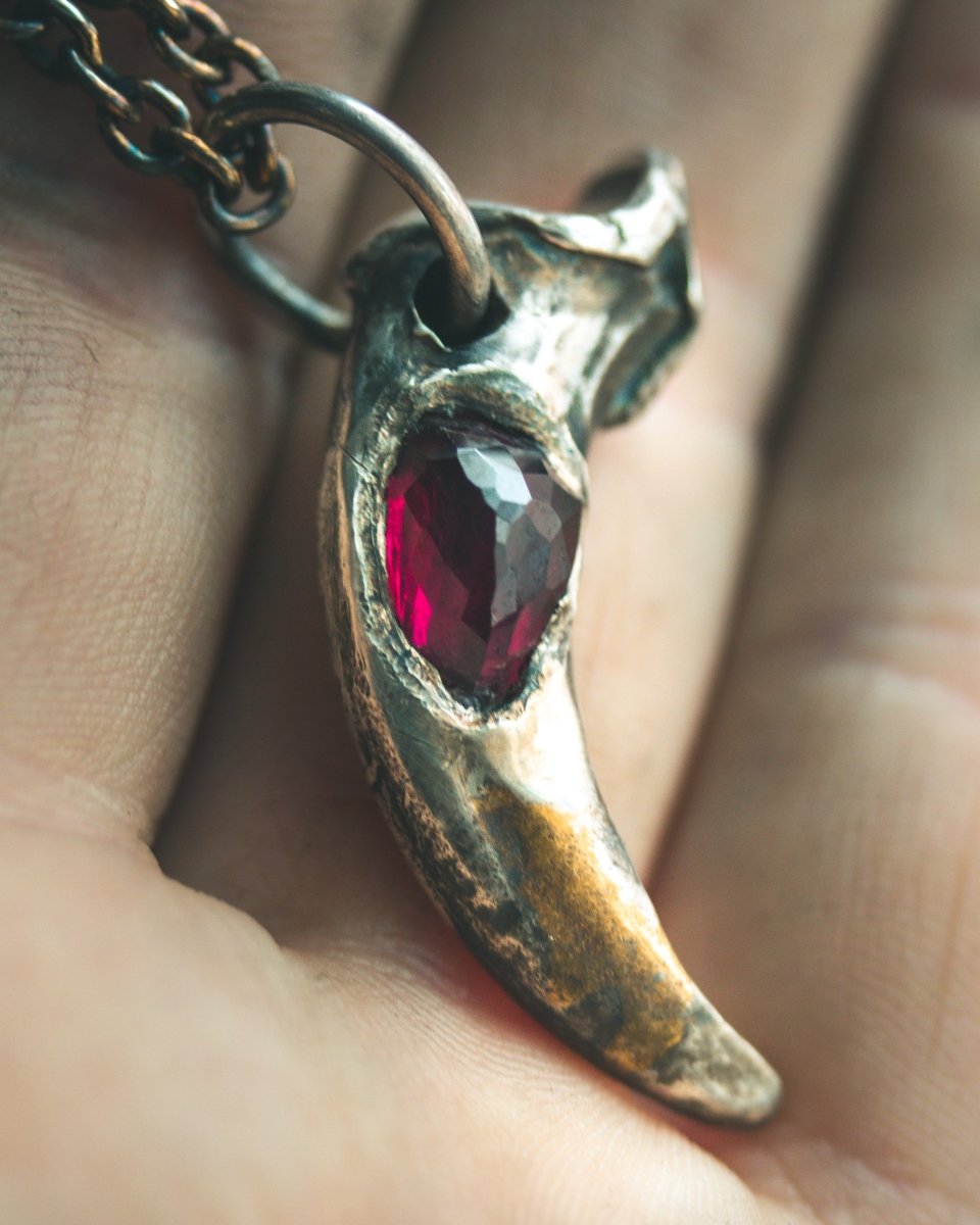 Lupus Spiritus Claw with Rhodolite Garnet: A Symbol of Guardianship, Loyalty, and Transformation - Machinations