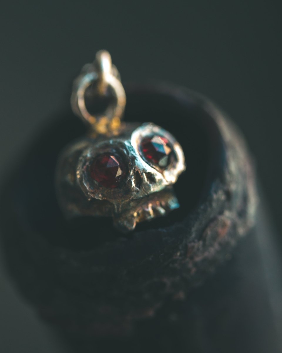 Memento Mori Skull Charm with Almandine Garnet Eyes – Sterling Silver & 23.5K Gold | Talisman of Life, Death, and Deep Transformation - Machinations