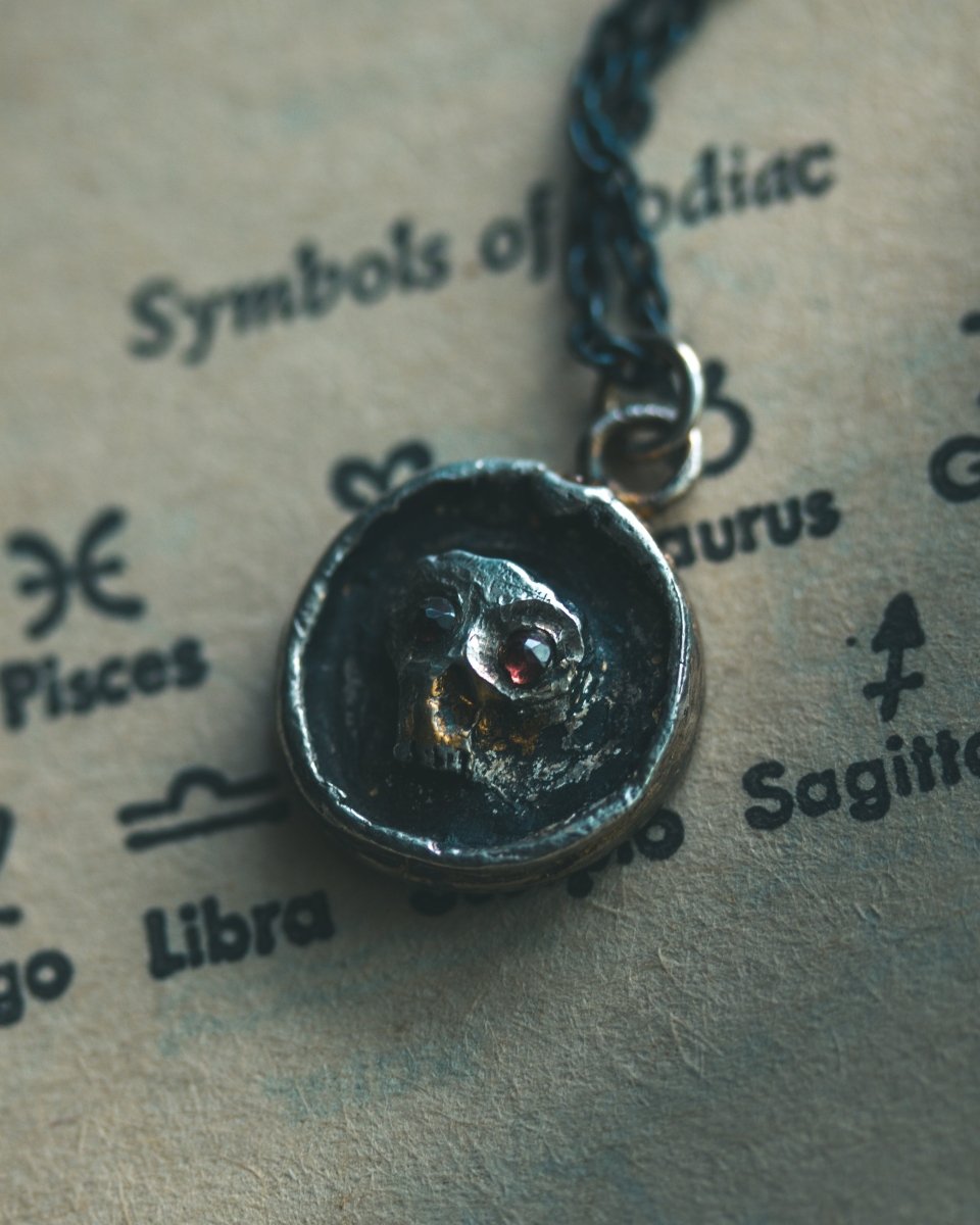 Memento Mori Skull Charm with Almandine Garnet Eyes Sterling Silver & 23.5K Gold | Talisman of Life, Death, and Deep Transformation - Machinations