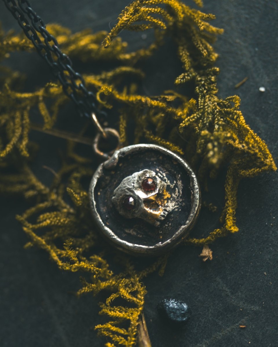 Memento Mori Skull Charm with Almandine Garnet Eyes Sterling Silver & 23.5K Gold | Talisman of Life, Death, and Deep Transformation - Machinations