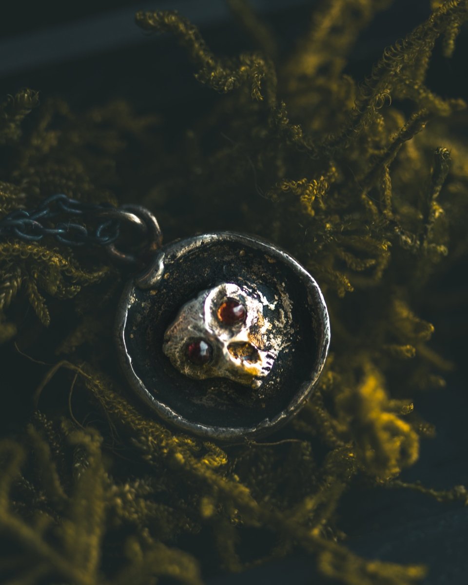 Memento Mori Skull Charm with Almandine Garnet Eyes Sterling Silver & 23.5K Gold | Talisman of Life, Death, and Deep Transformation - Machinations