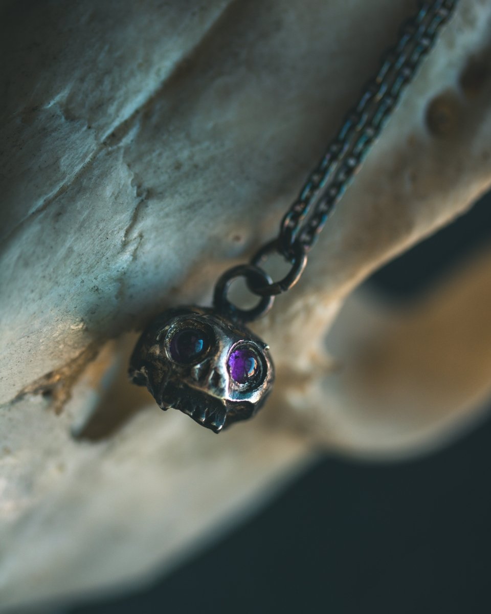 Memento Mori Skull Charm with Amethyst Eyes: A Reflection of Life’s Duality - Machinations