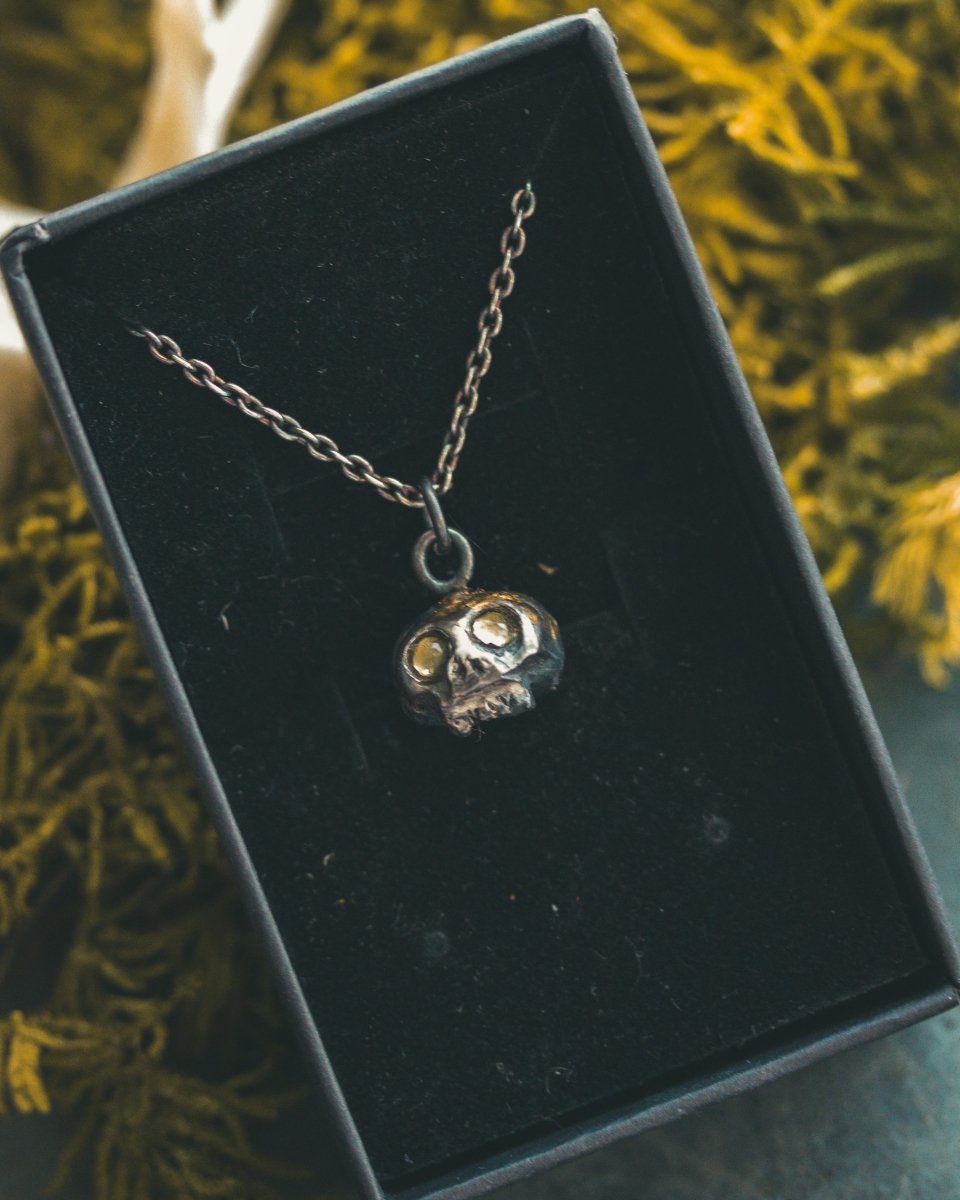 Memento Mori Skull Charm with Peridot Eyes: A Reflection of Life’s Duality - Machinations