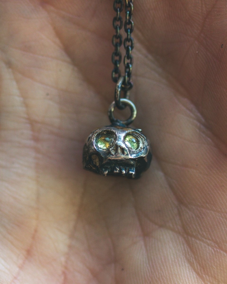 Memento Mori Skull Charm with Peridot Eyes: A Reflection of Life’s Duality - Machinations
