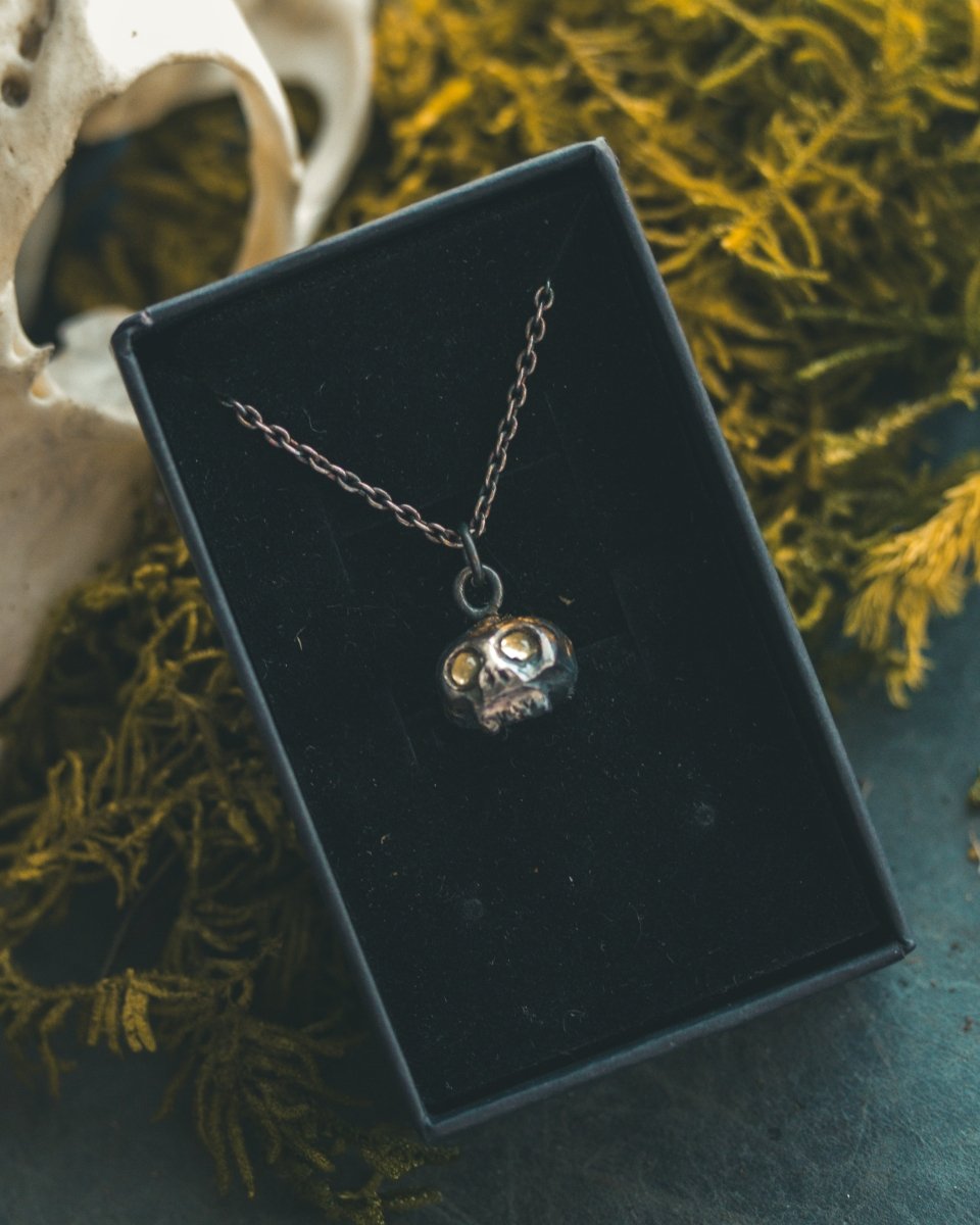 Memento Mori Skull Charm with Peridot Eyes: A Reflection of Life’s Duality - Machinations