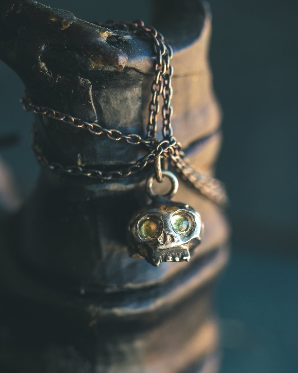 Memento Mori Skull Charm with Peridot Eyes: A Reflection of Life’s Duality - Machinations