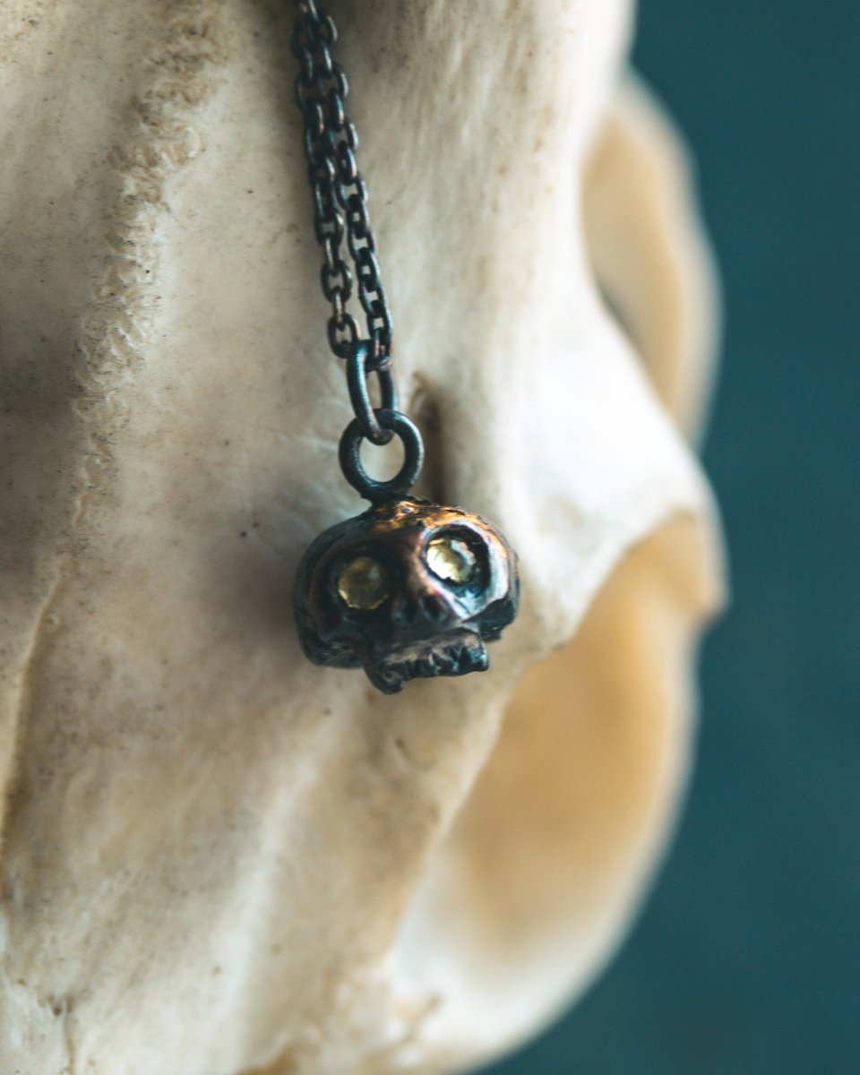 Memento Mori Skull Charm with Peridot Eyes: A Reflection of Life’s Duality - Machinations