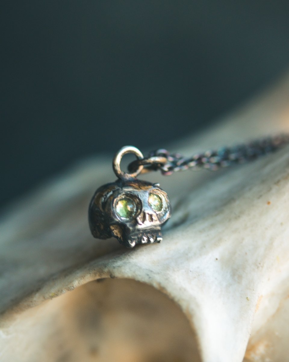 Memento Mori Skull Charm with Peridot Eyes: A Reflection of Life’s Duality - Machinations
