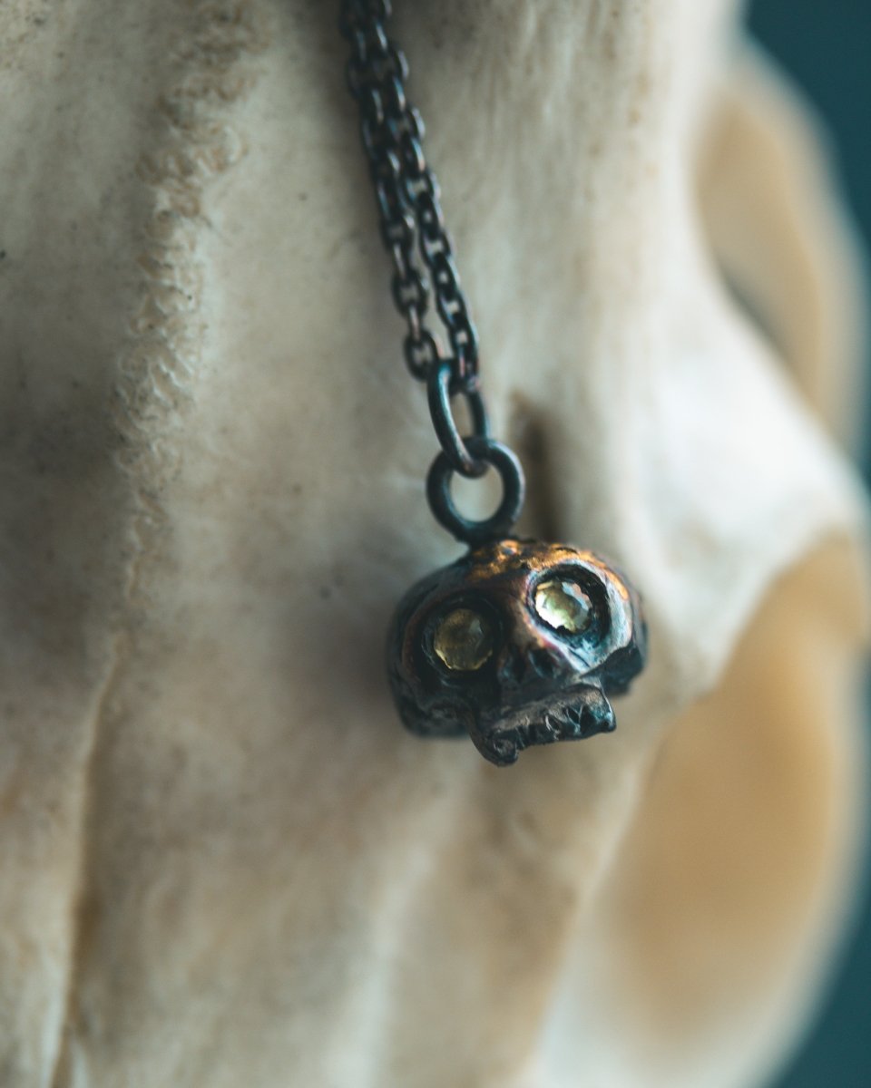 Memento Mori Skull Charm with Peridot Eyes: A Reflection of Life’s Duality - Machinations