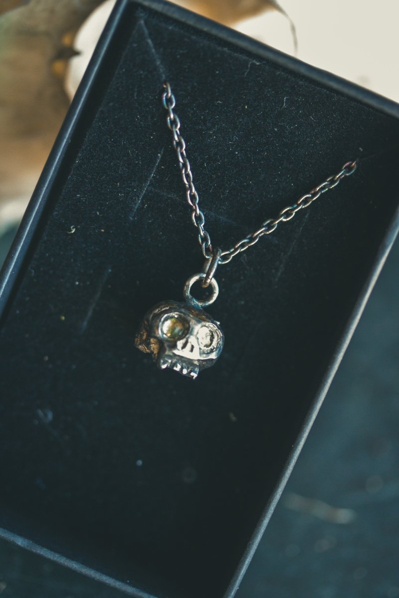 Memento Mori Skull Charm with Peridot Eyes: A Reflection of Life’s Duality - Machinations