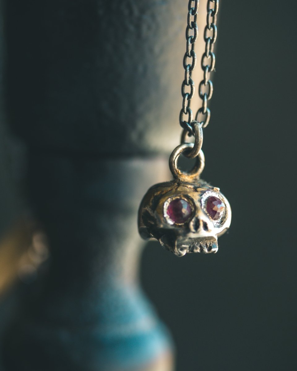 Memento Mori Skull Charm with Rose - Cut Rhodolite Garnet – Sterling Silver & 23.5K Gold | Symbol of Mortality, Strength and Passion - Machinations