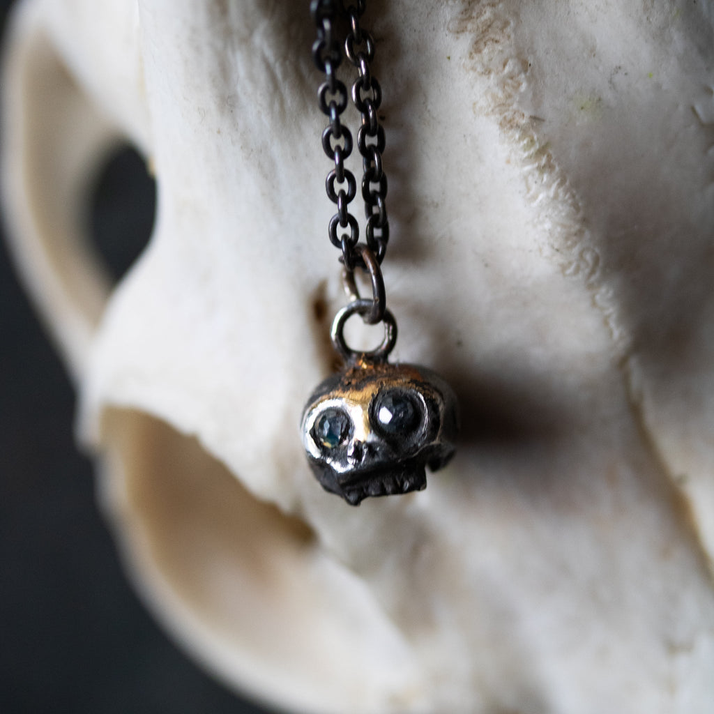 Skull charm with Moonstone eyes - Machinations
