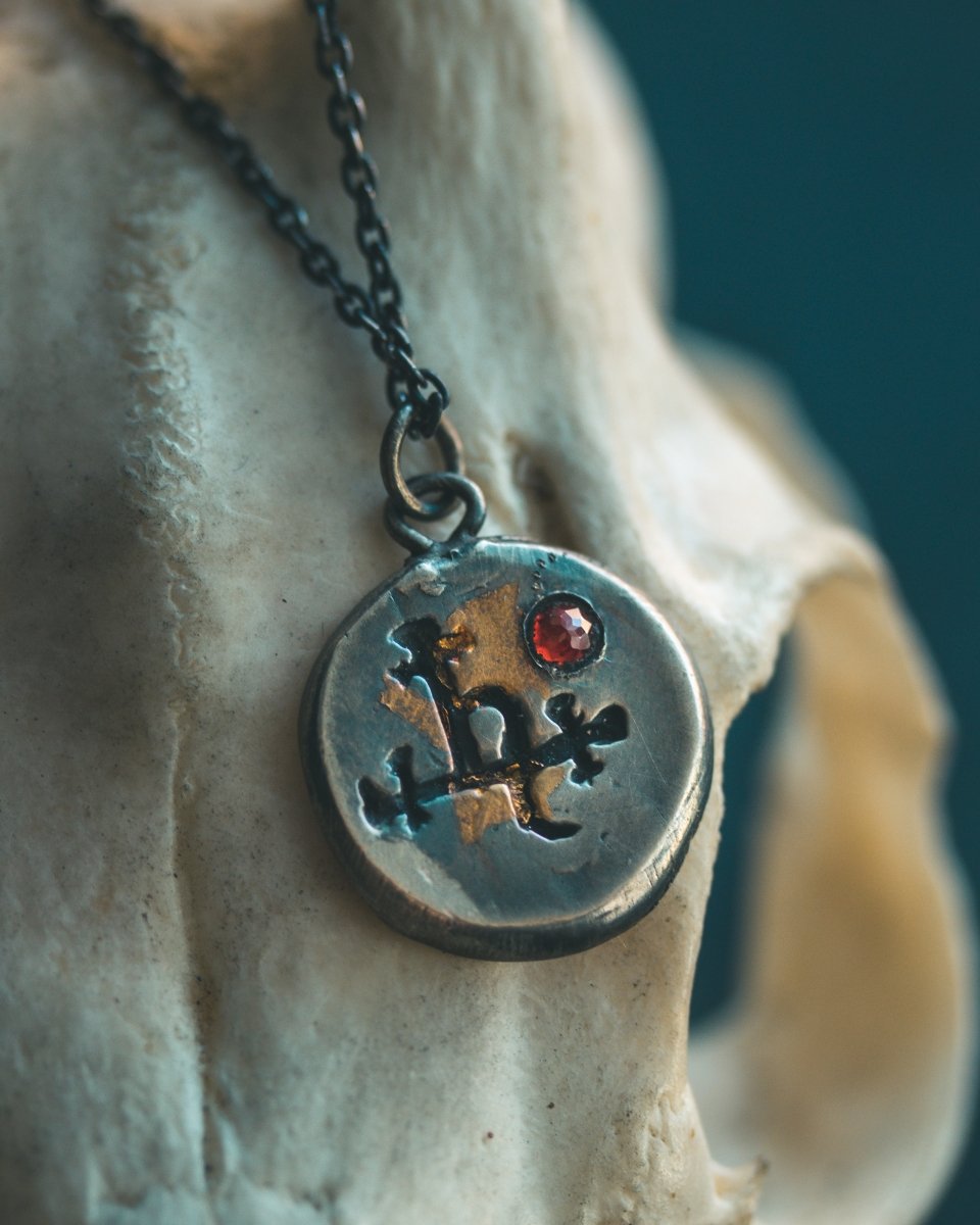 The Lilith Charm with Almandine Garnet: A Talisman of Empowerment in Sterling Silver and Gold - Machinations
