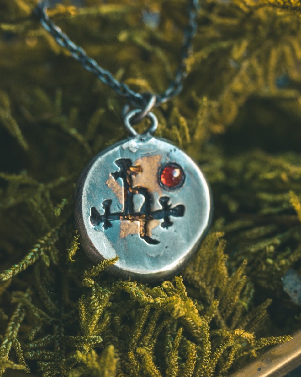 The Lilith Charm with Almandine Garnet: A Talisman of Empowerment in Sterling Silver and Gold - Machinations