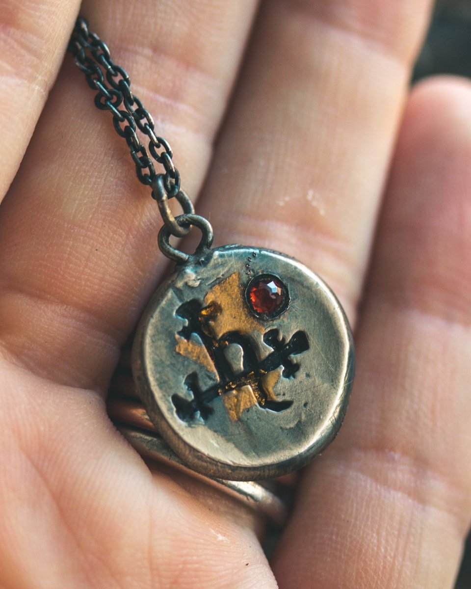 The Lilith Charm with Almandine Garnet: A Talisman of Empowerment in Sterling Silver and Gold - Machinations