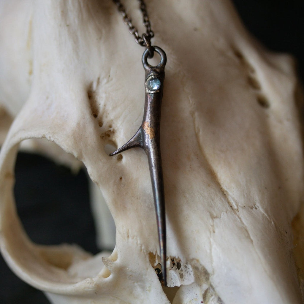 Thorn and Aquamarine Pendant: Emblem of Beauty and Serenity - Machinations