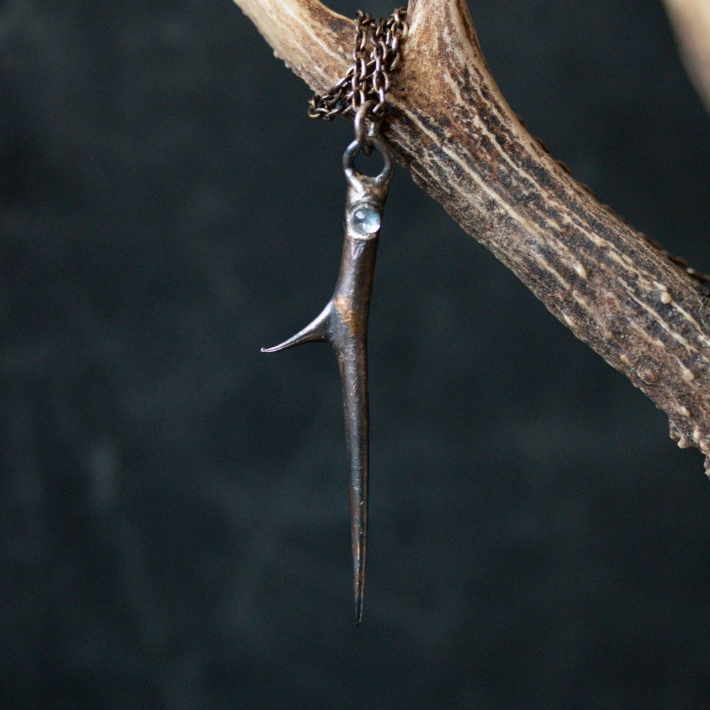Thorn and Aquamarine Pendant: Emblem of Beauty and Serenity - Machinations