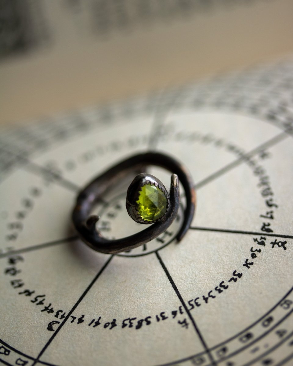Thorn and Peridot Ring: Emblem of Resilience and Renewal - Machinations