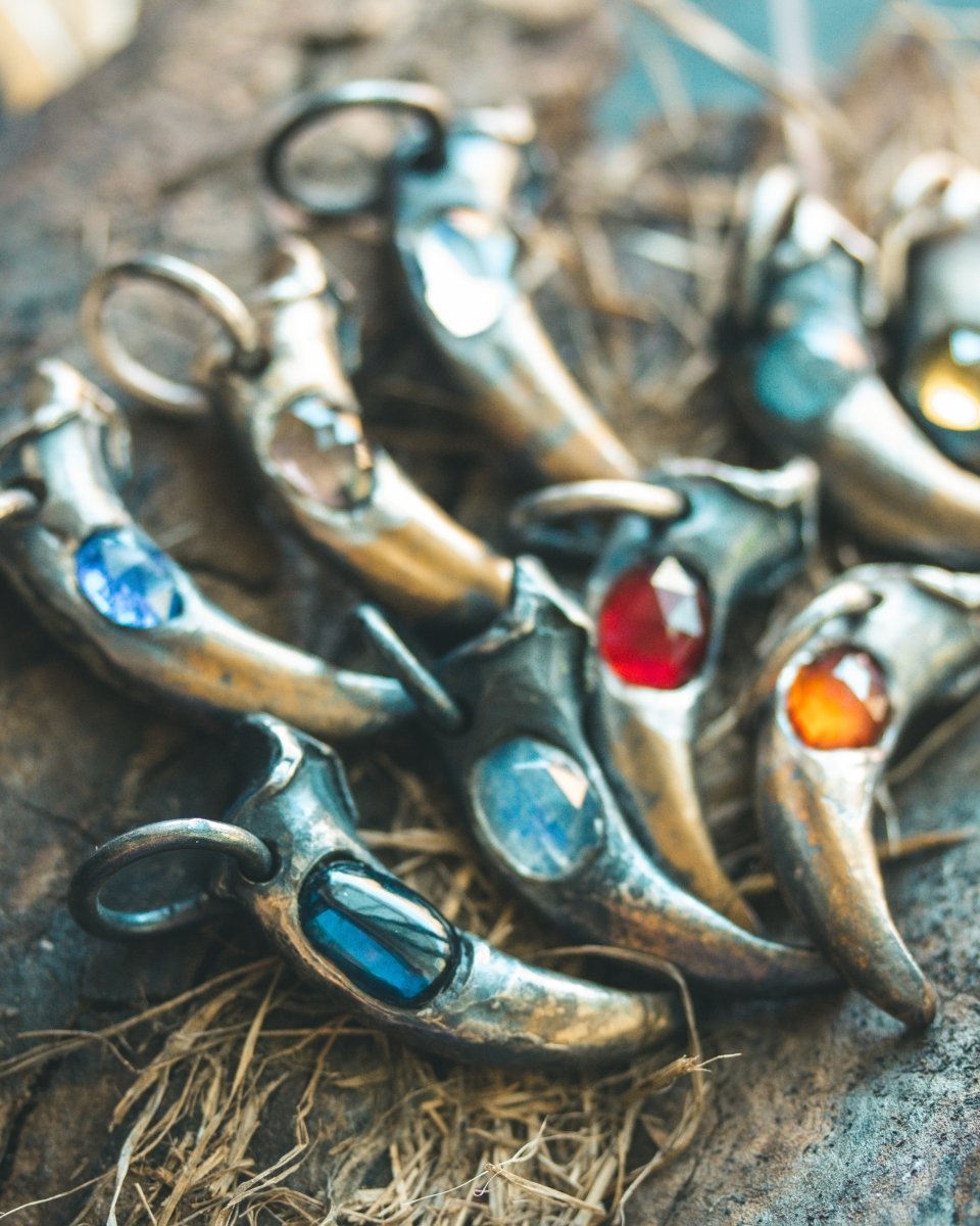 Wolf Claw Pendant with Almandine Garnet: Symbol of Strength, Passion, and Guardianship - Machinations