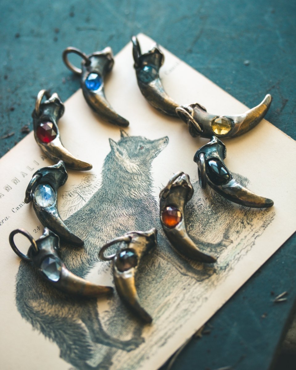 Wolf Claw Pendant with Almandine Garnet: Symbol of Strength, Passion, and Guardianship - Machinations