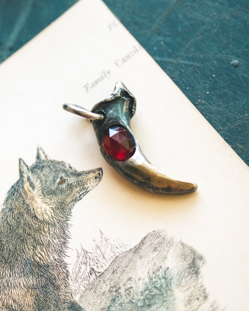 Wolf Claw Pendant with Almandine Garnet: Symbol of Strength, Passion, and Guardianship - Machinations