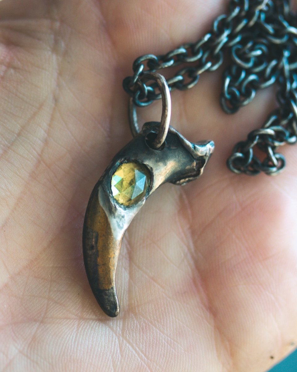 Wolf Claw Pendant with Peridot: Symbol of Guardianship, Renewal, and Spiritual Growth - Machinations
