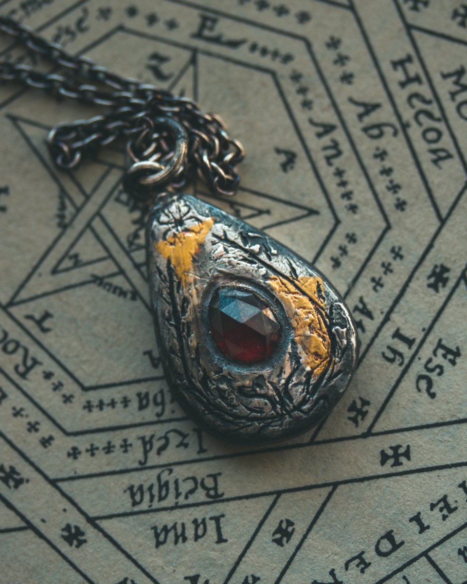 Yaga's Cabinet: Wheat & Flame Talisman | Sterling Silver | 23.5K Keum - boo Gold | Almandine Garnet - Machinations